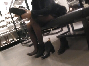 Candid legs in a shoe store