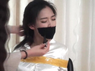 Asian Girl Taped and Stuffed